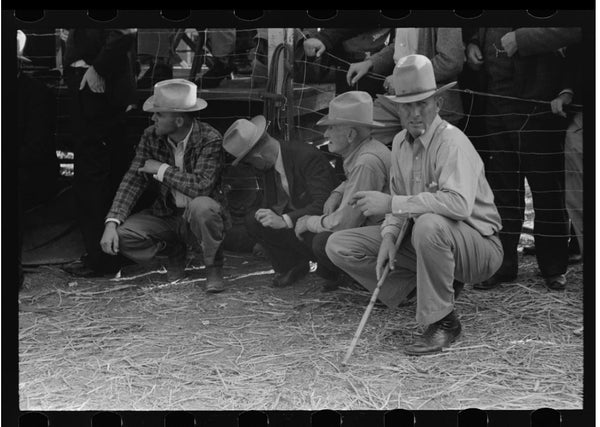 An old black & white photo of Texas cowboys