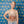 A Woman wearing a Y'all Be Kind Tank Top in front of a patterned background
