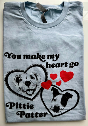 Blue t-shirt with two cute hand-drawn pit bull dogs in hearts, that says "you make my heart go pittie patter"