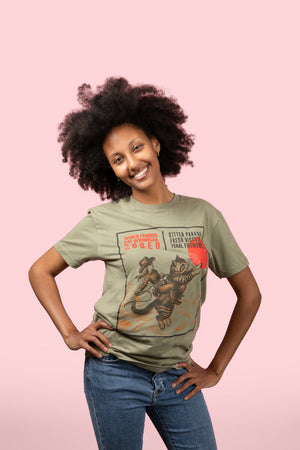 Woman wearing a graphic t-shirt with a cat and text design on a pink background
