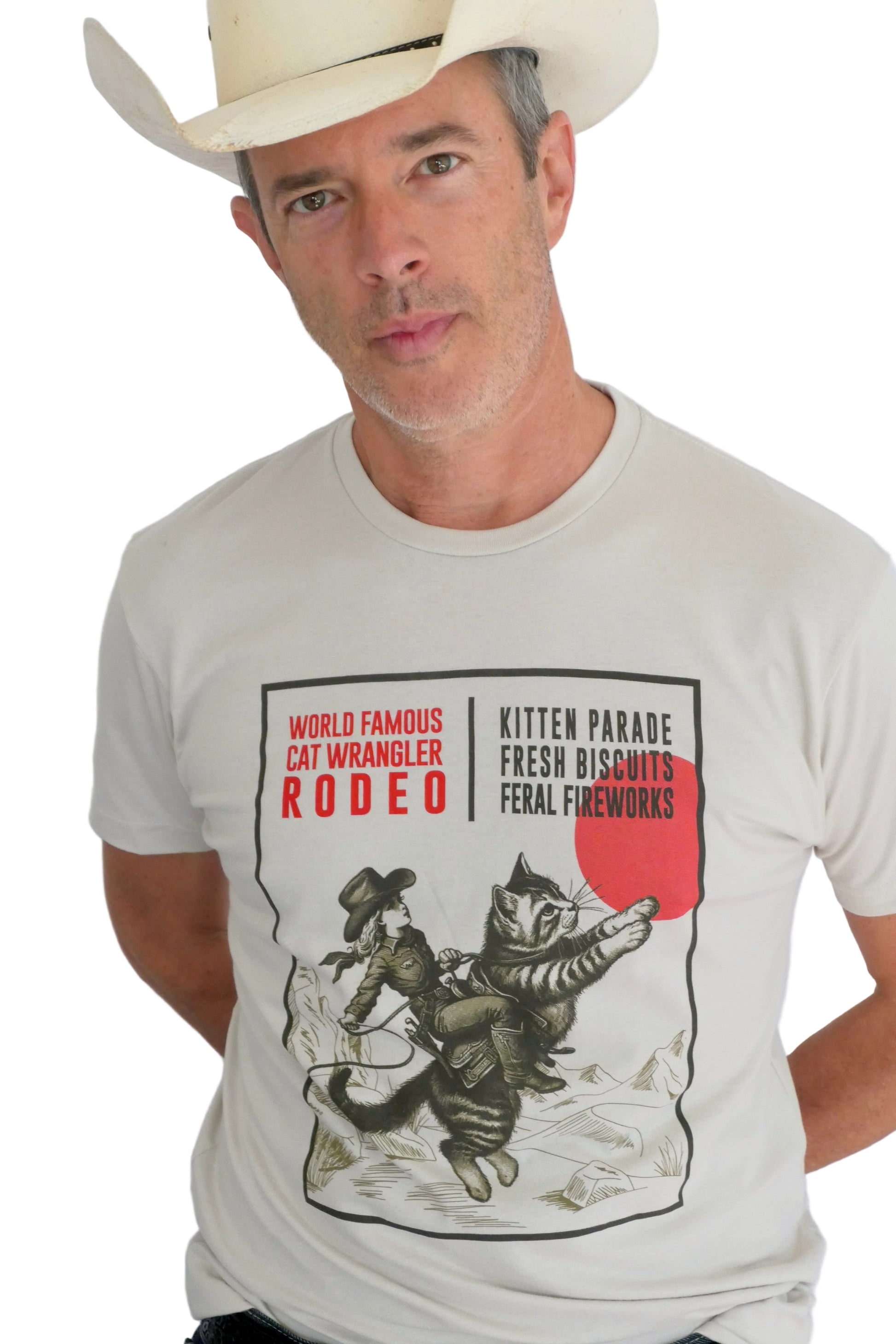 Man wearing a t-shirt with a cat wrangler rodeo design