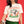 Close up view of Pet Rodeo's Spicy Chihuahua Tshirt on a woman with a small dog