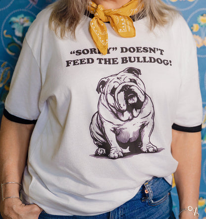 close up image of woman wearing Pet Rodeo's Sorry Doesn't Feed the Bulldog Vintage Ringer T-shirt