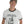 Man wearing a white retro ringer t-shirt with a bulldog design
