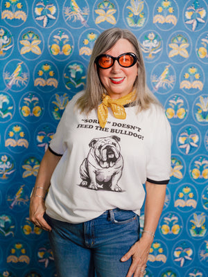 Woman wearing Pet Rodeo's Sorry Bulldog Tshirt with a yellow bandana
