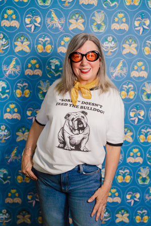 Woman wearing Pet Rodeo's Sorry Bulldog Tshirt with a yellow bandana
