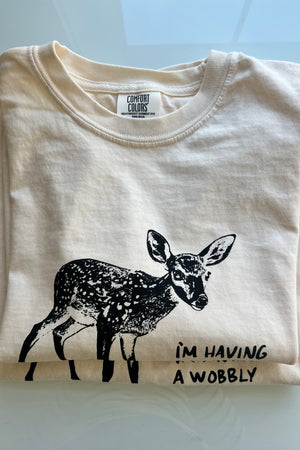 Two t-shirts in a stack with a baby deer graphic